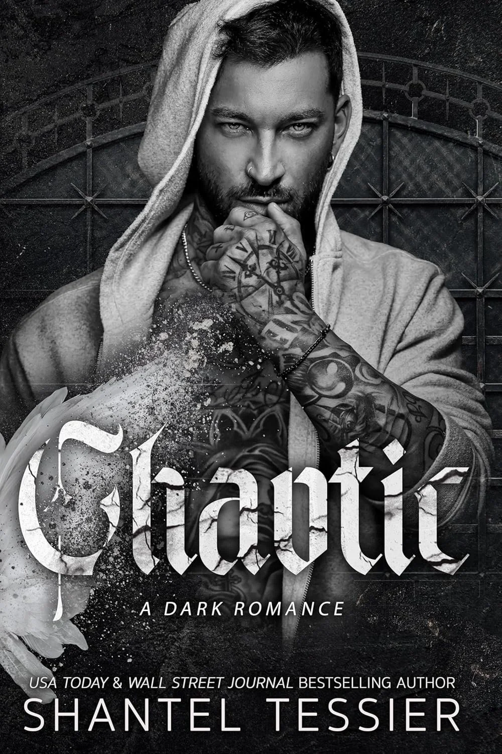 Black and white book cover featuring a tattooed man in a hoodie touching his chin, with the title "Chaotic" and subtitle "A Dark Romance" by Shantel Tessier.