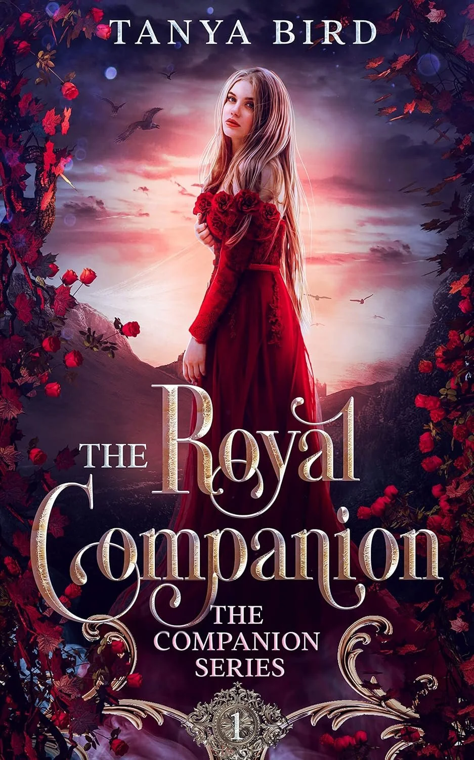 Book cover for 'The Royal Companion' by Tanya Bird featuring a young woman with long blonde hair in a red dress holding red roses, with a background of a sunset sky, mountains, and flying birds, framed with red roses and dark foliage.