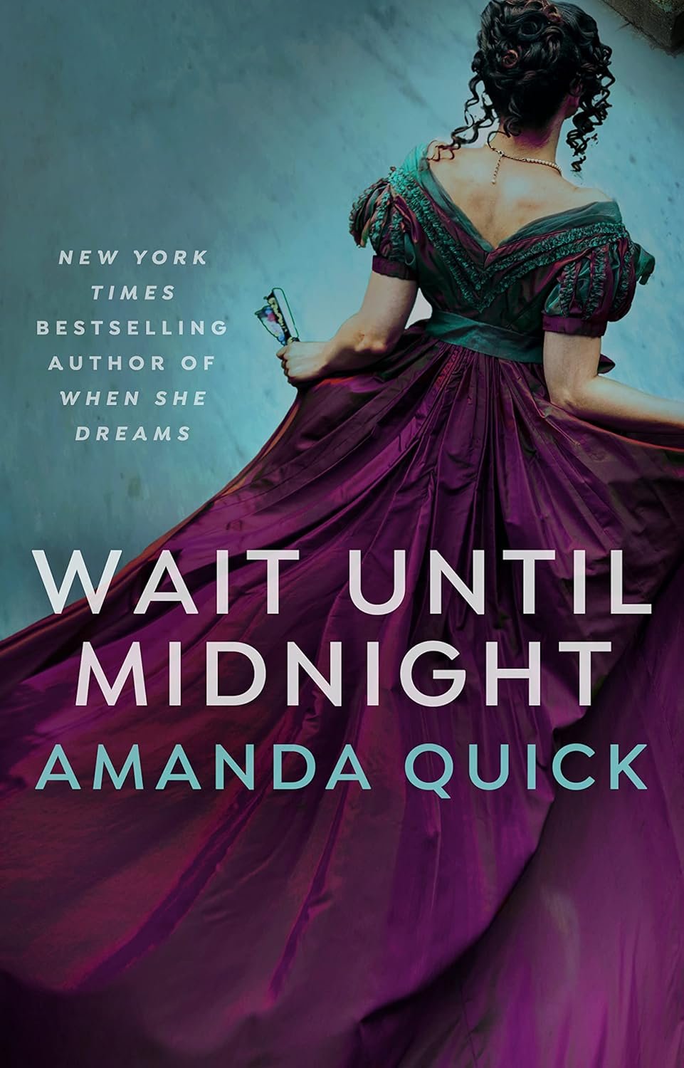 Book cover for "Wait Until Midnight" by Amanda Quick featuring a woman in a purple gown with curly black hair holding a butterfly-shaped fan.