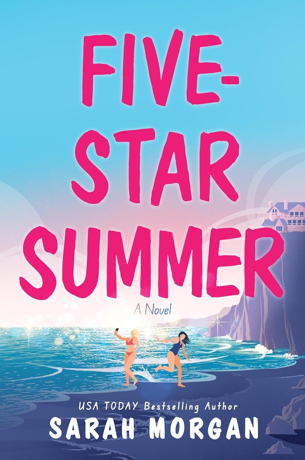Book cover for 'Five-Star Summer' by Sarah Morgan featuring two women in swimsuits at the beach, with cliffs and houses in the background, and a blue sky.