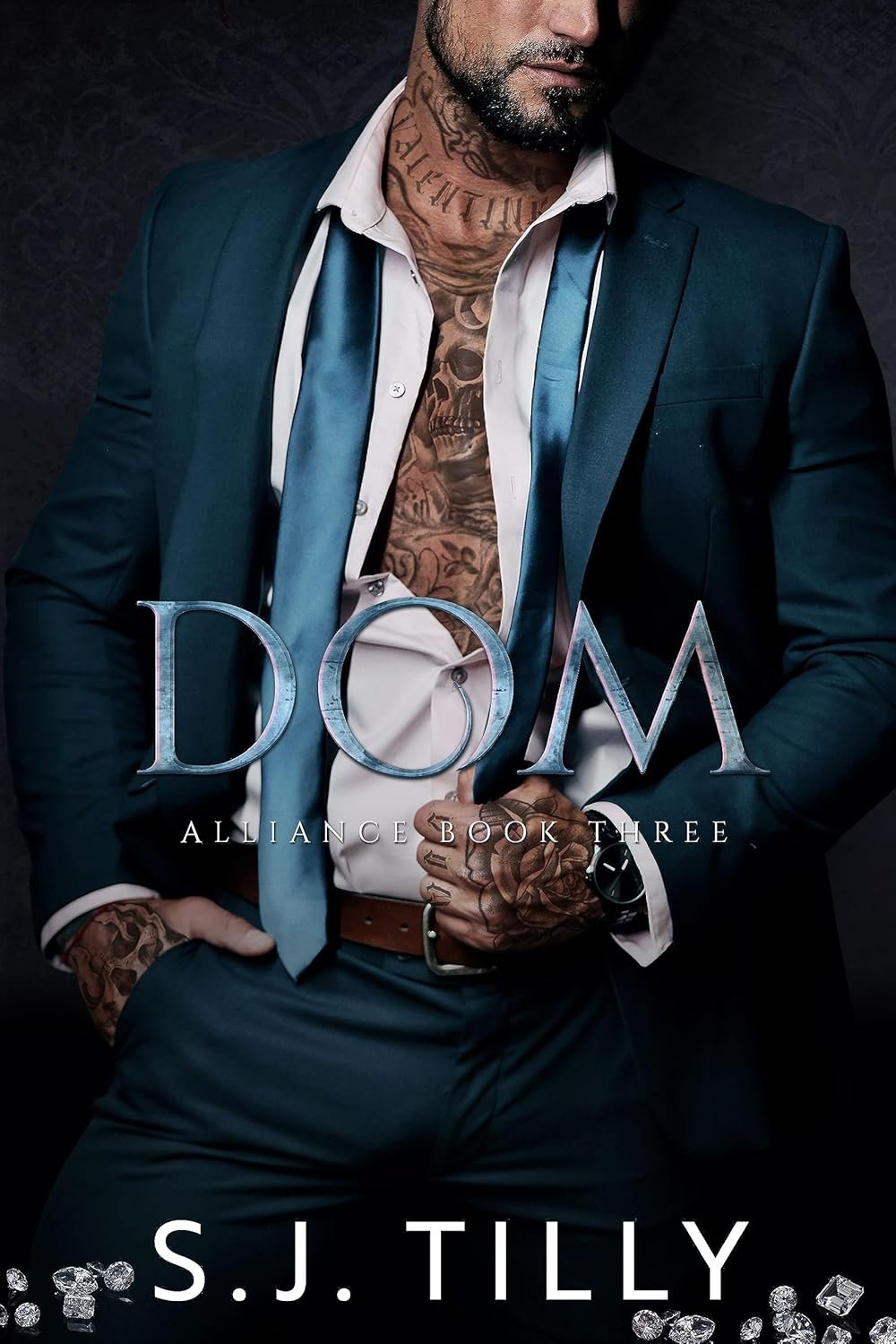 Book cover for 'DOM: Alliance Book Three' by S. J. Tilly, featuring a man in a dark suit with an open white shirt, visible tattoos, and a dark background.