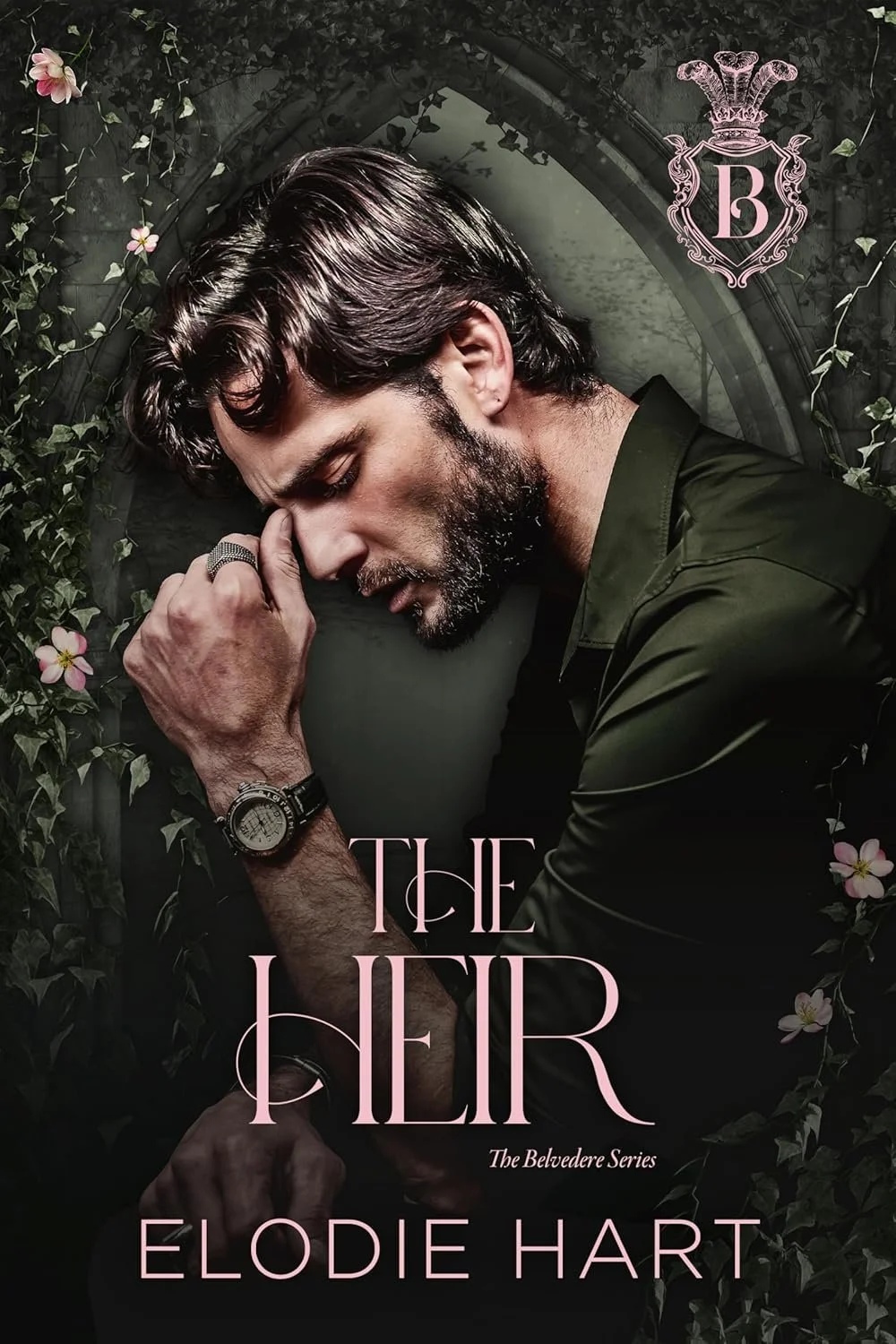 Cover of the book titled "The Heir" by Elodie Hart, featuring a man with dark hair and a beard, wearing a dark green shirt, in a contemplative pose with his eyes closed, touching his forehead, surrounded by vines and pink flowers.