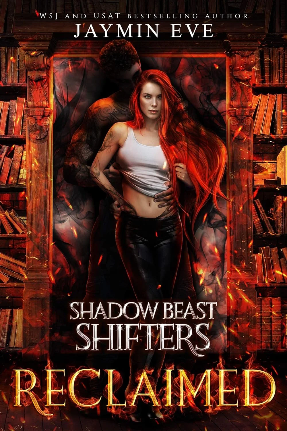 Book cover for 'Reclaimed' by Jaymin Eve featuring a young woman with long red hair, in a white crop top and black leather pants, standing in front of an ominous figure with dark tattoos, surrounded by shelves of old books with fiery effects.