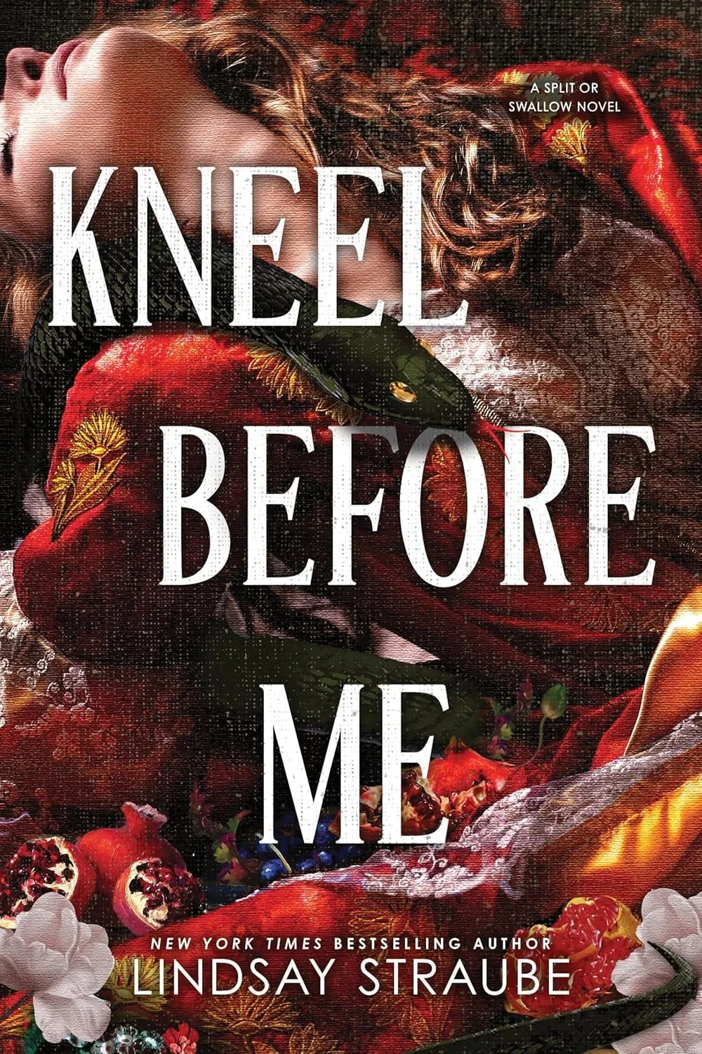 Book cover for "Kneel Before Me" by Lindsay Straube. Features a woman with red hair resting on a fiery red surface, surrounded by fruits like pomegranate and berries, with a snake entwined around her.
