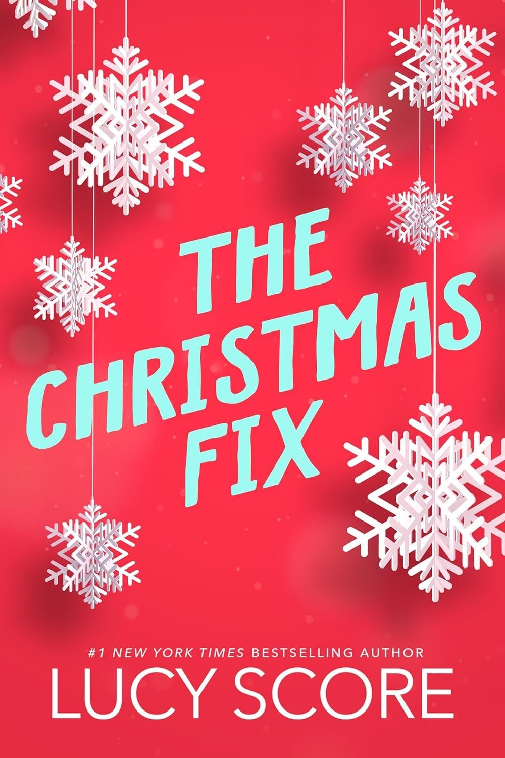 Book cover for The Christmas Fix by Lucy Score is red with white snowflakes hanging like ornaments