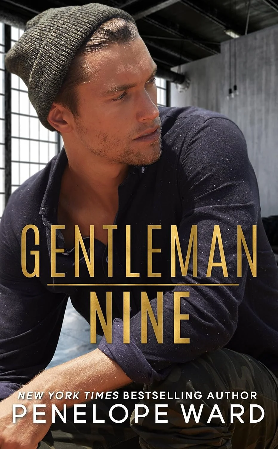 A young man with blonde hair, wearing a gray beanie and a dark shirt, looking to the side with a serious expression. The background shows an industrial-style interior with large windows and metal piping. The text on the cover reads "Gentleman Nine" by Penelope Ward, described as a New York Times bestselling author.