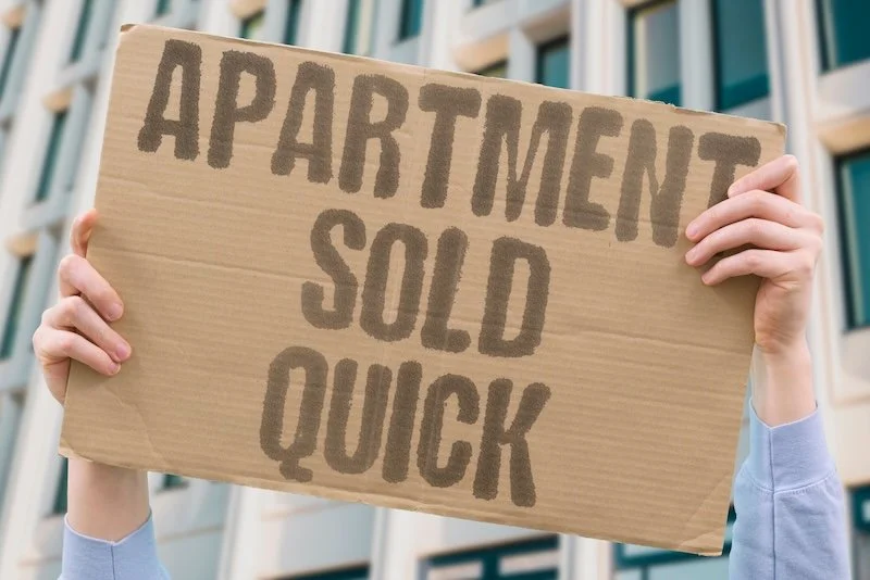 How to sell a home quickly in Ottawa - cardboard sign says apartment sold quick