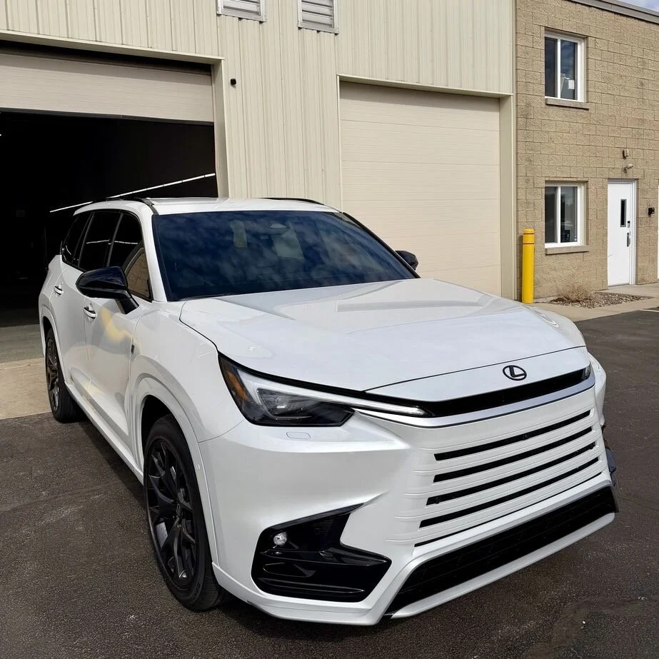 Lexus TX with track pack paint protection film, ceramic window tint, 2 year ceramic coating done at PrimeVue Protection in Plainfield, IL