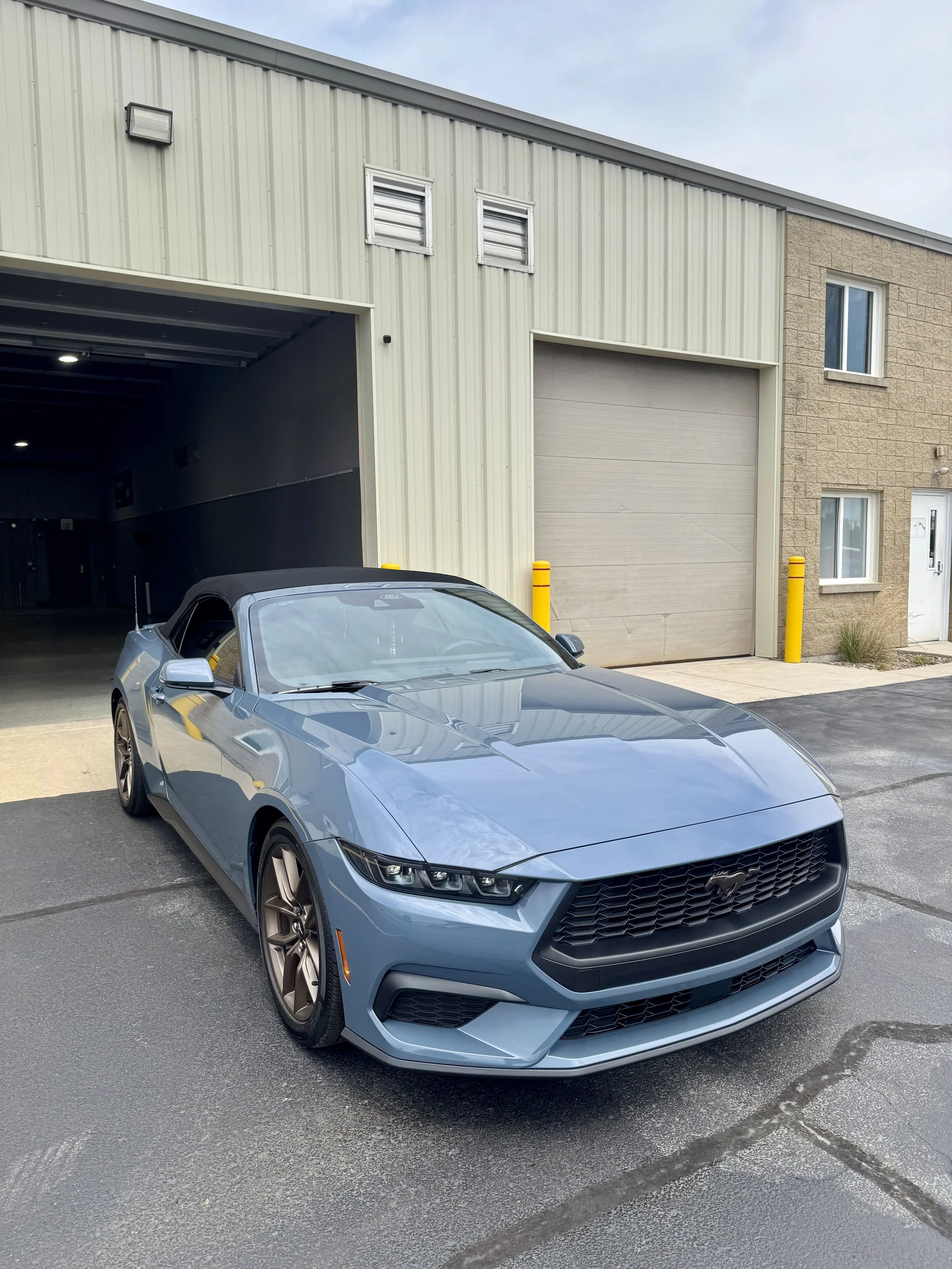 Ford Mustang with full front paint protection film parked outside PrimeVue in Plainfield