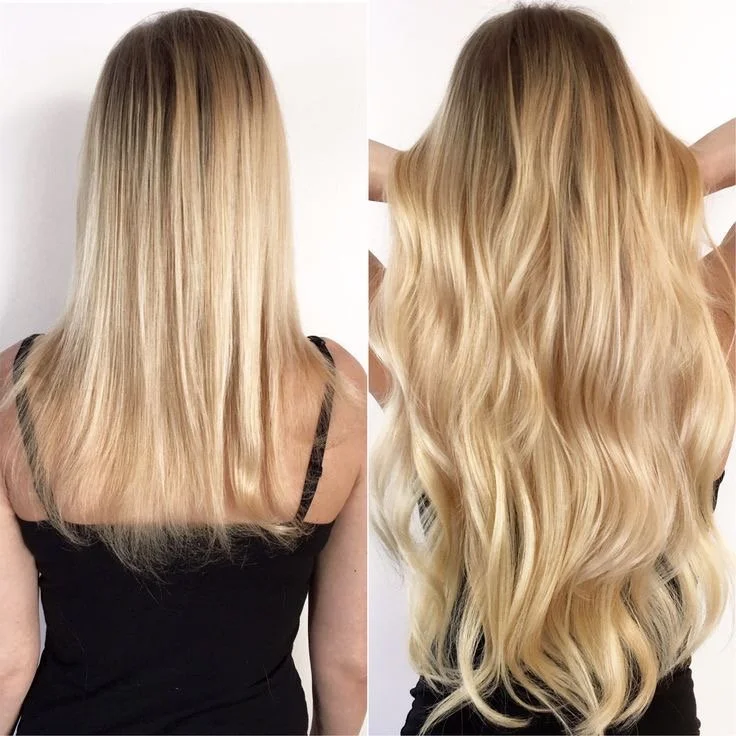 Side-by-side comparison of a woman's hair before and after a hair transformation, showing darker, straight hair on the left and long, voluminous, wavy blonde hair on the right.