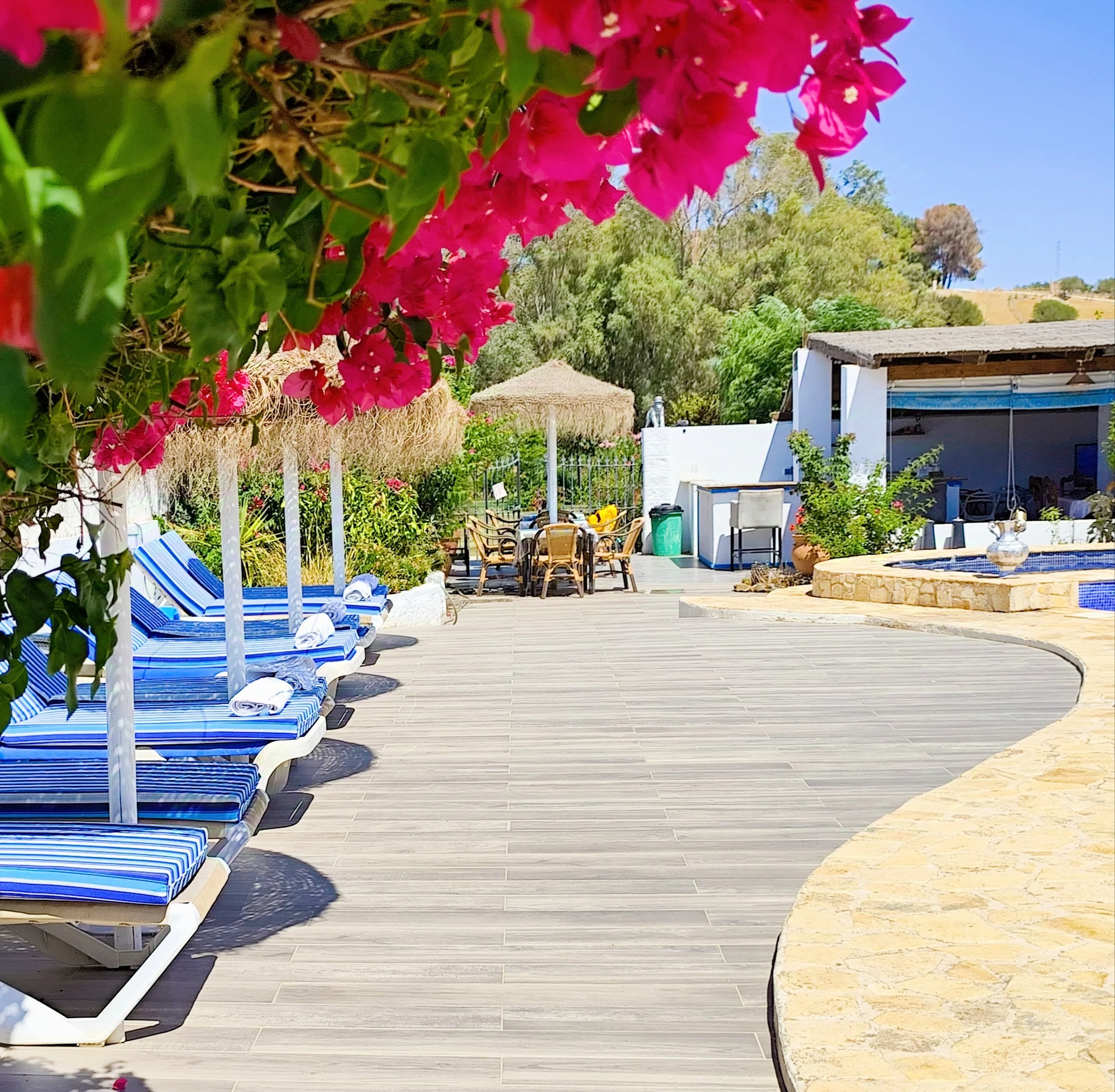 A calm moment by the pool, before the wedding magic begins. The setting is natural and unstyled, offering a glimpse of the retreat's tranquil waters, open skies, and the quiet anticipation of what's to come. It's a peaceful pause before the transfor