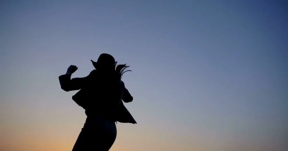 Woman jumping aginst a night sky.jpg