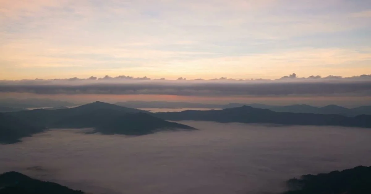 sunrise over clouds and mountains.jpg