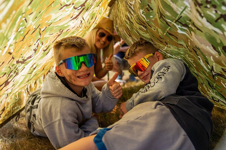 Family enjoying outdoor adventure at glamping festival
