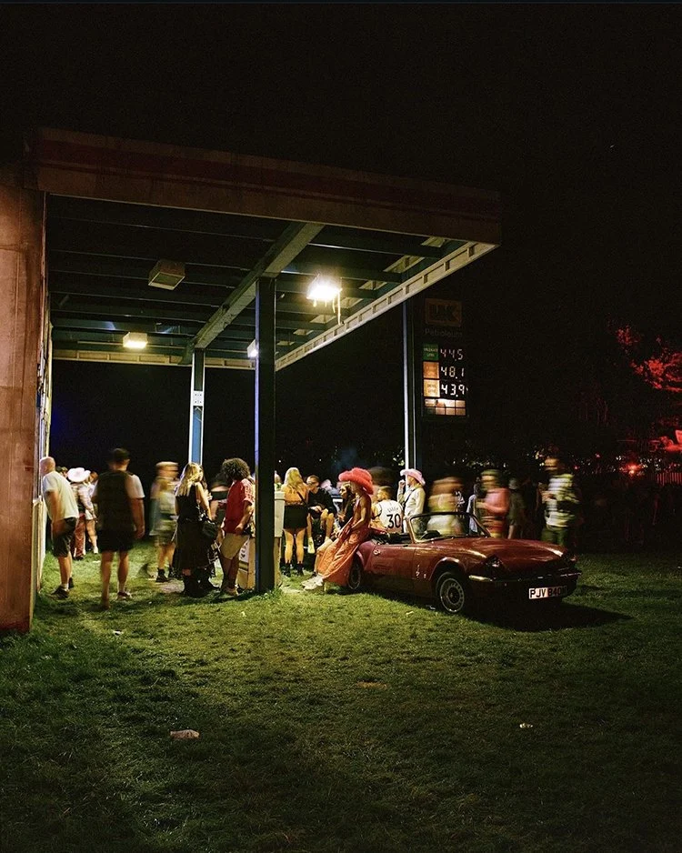 Guests gathered at one of our pop-up bars at our glamping village 