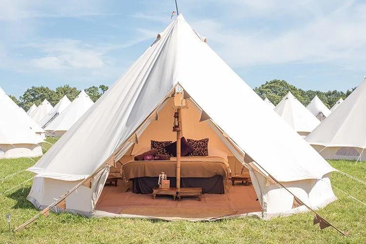 View of cosy Deluxe bell tent at boutique glamping site