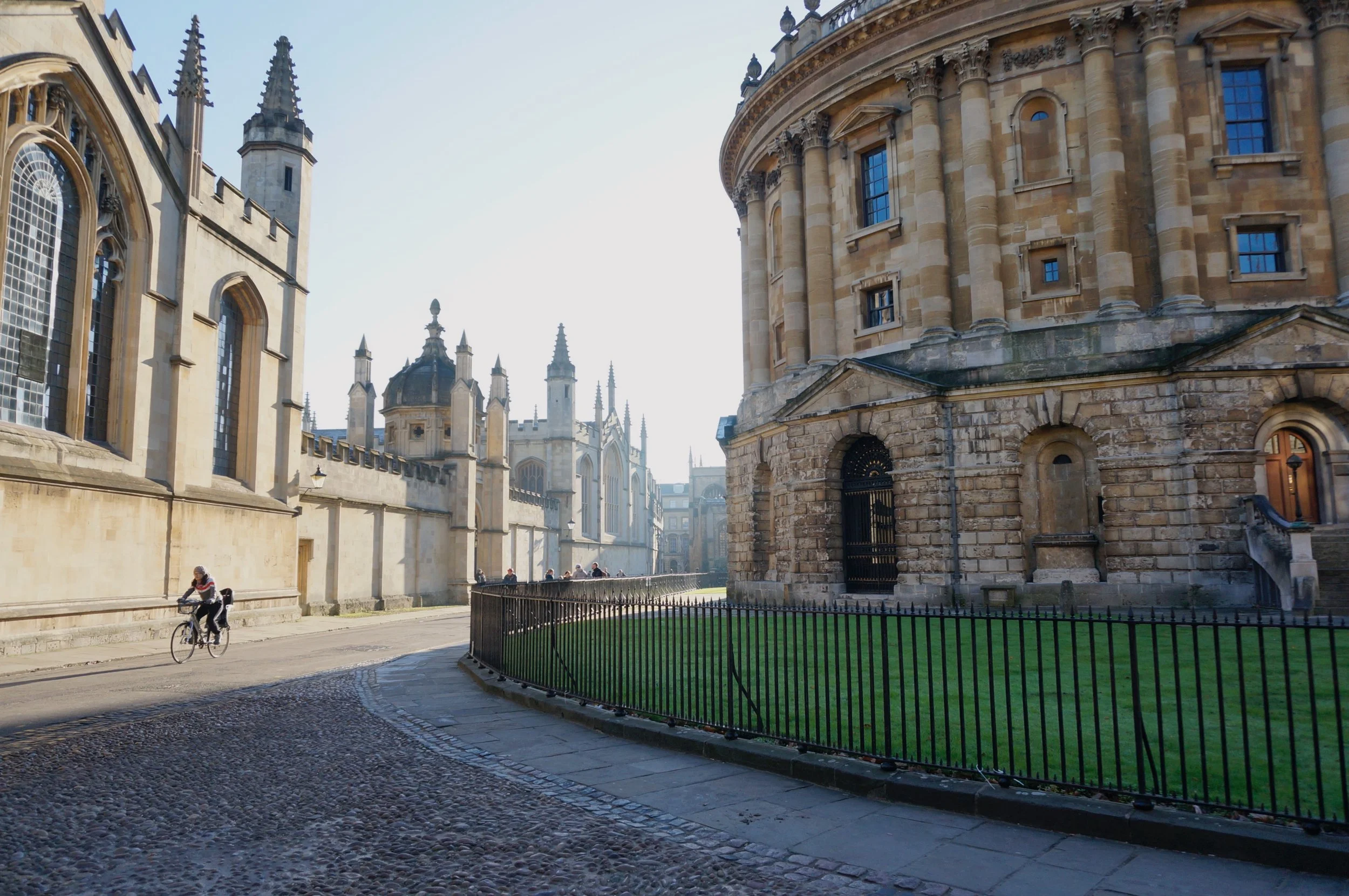 Radcliffe Camera and surrounding architecture in Oxford, cyclist on street