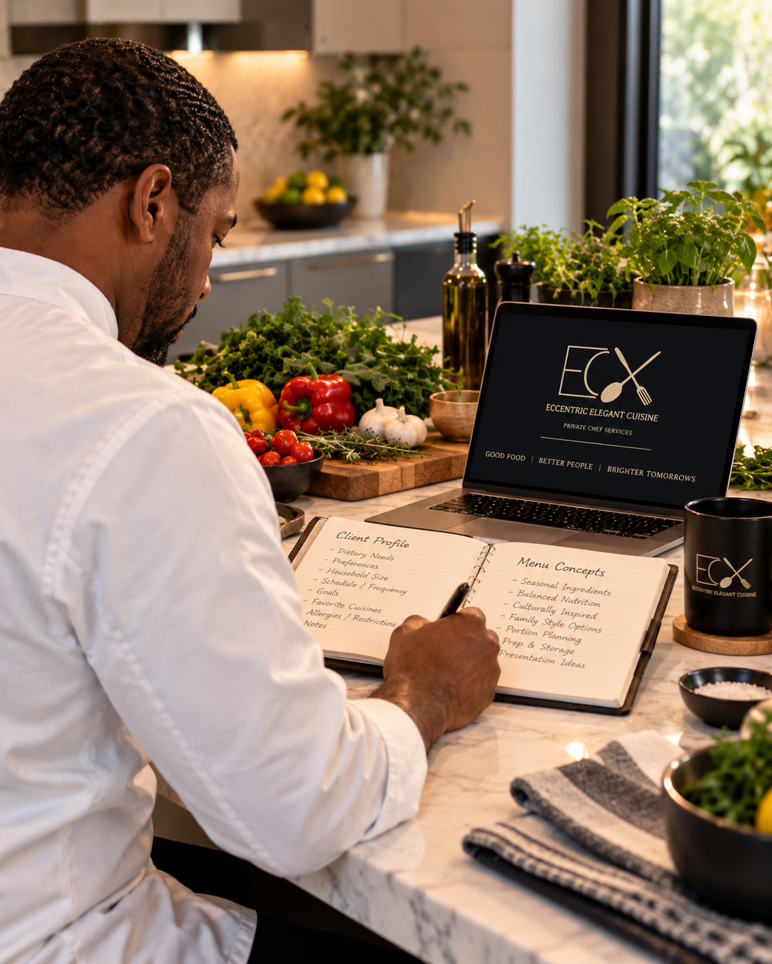 A chef sitting at a kitchen counter with fresh vegetables, a laptop, and a notebook, reviewing menu concepts and client profiles for a private chef service called 'Eccentric Elegant Cuisine.'