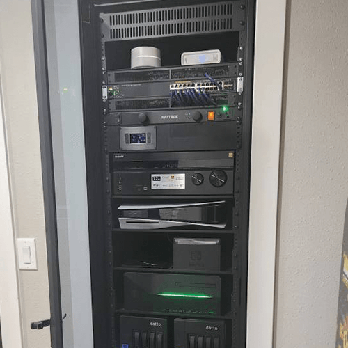 Residential smart home control panel installation in Sherman Oaks mounted in a modern living room