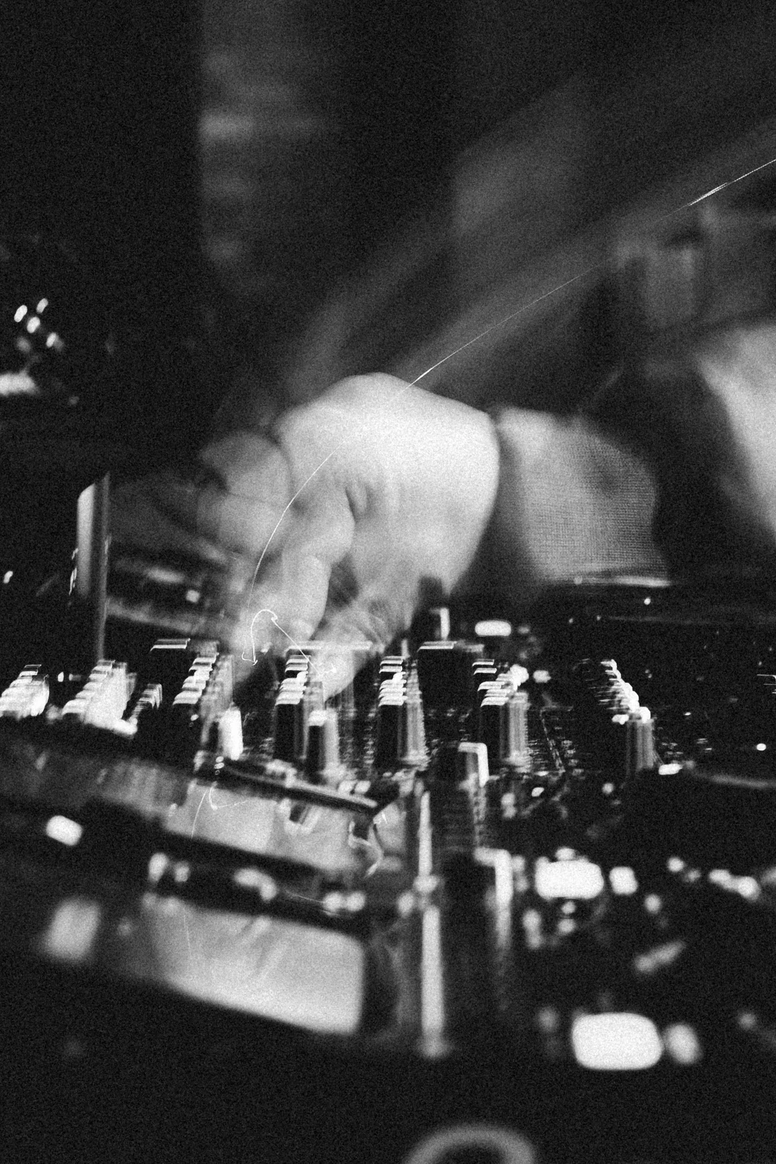 DJ mixing on decks during a live set, photography by BGL Media