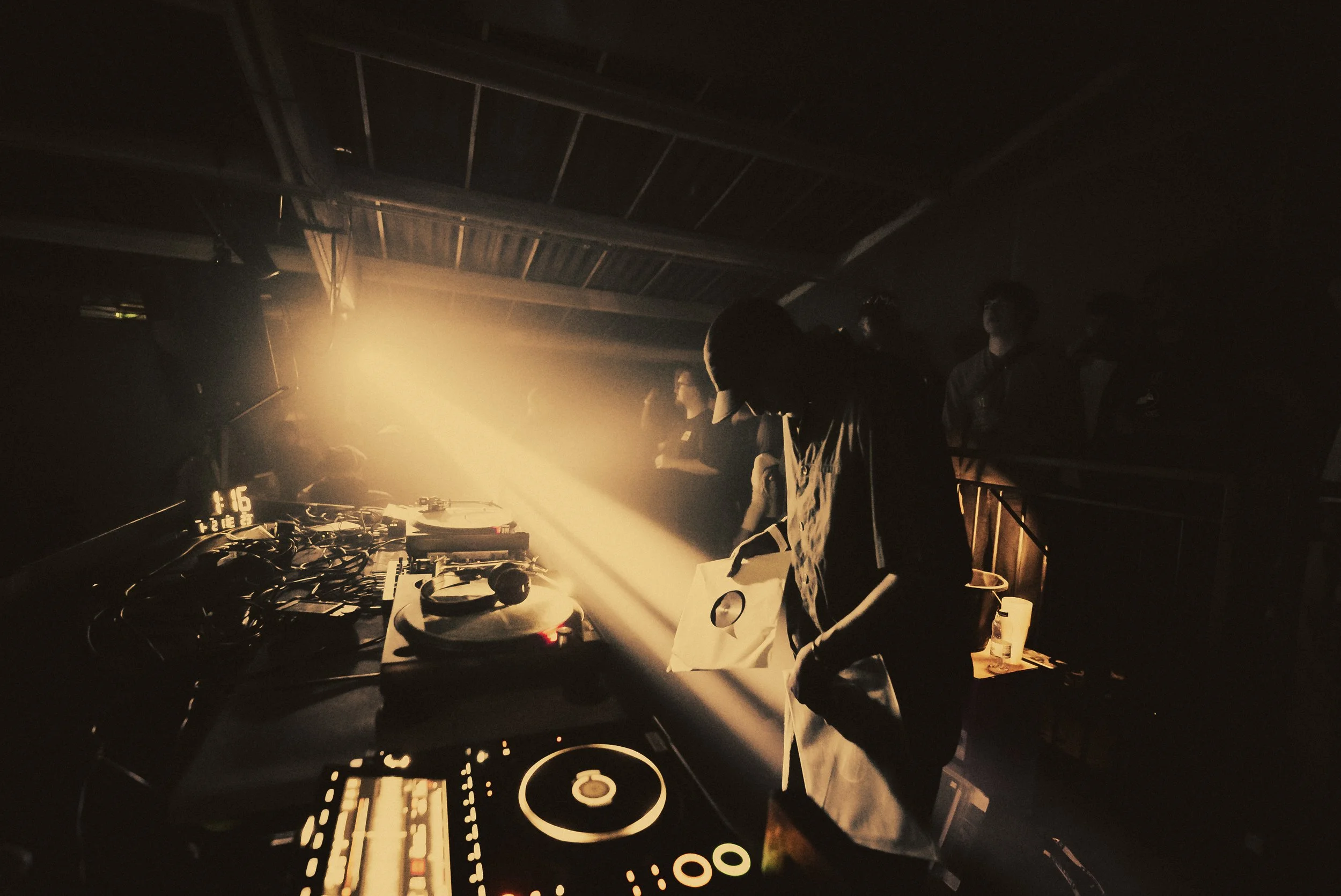 DJ performing live at a show, photography by BGL Media