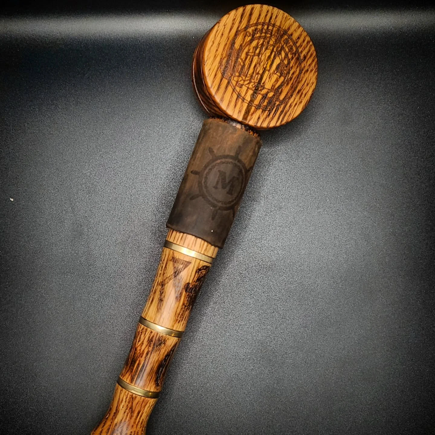 Ahoy Matey!
.
This is the kind of request I love to get, incredibly unique one-of-a-kind items. For my Sigma Phi Epsilon brother, Monty.
.
Made of alternating grain Oak with Shou-Sugi-Ban grain accenting, brass, and leather. Meant of give the appeara