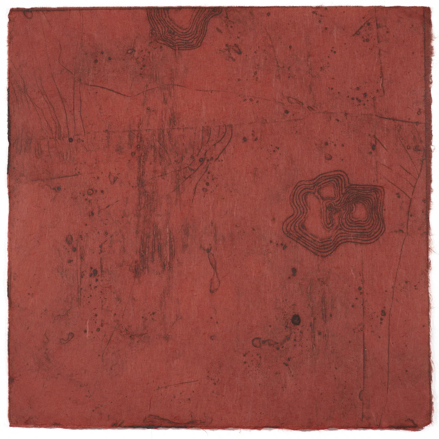 Red textured surface with black line markings and contours, resembling a map or abstract artwork.