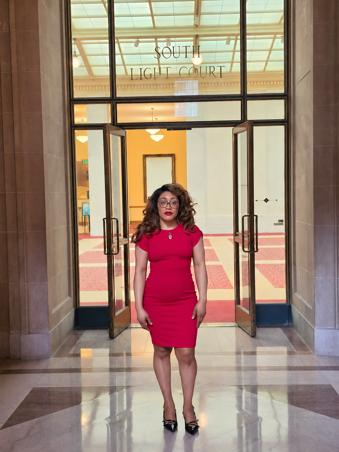 Attorney Sauve M. Sonkey inside South Light Court at San Francisco City Hall.