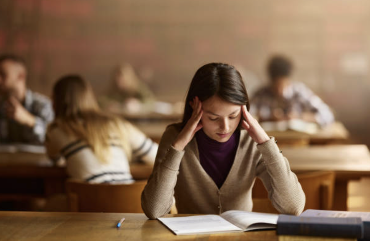 girl stressed sitting at table