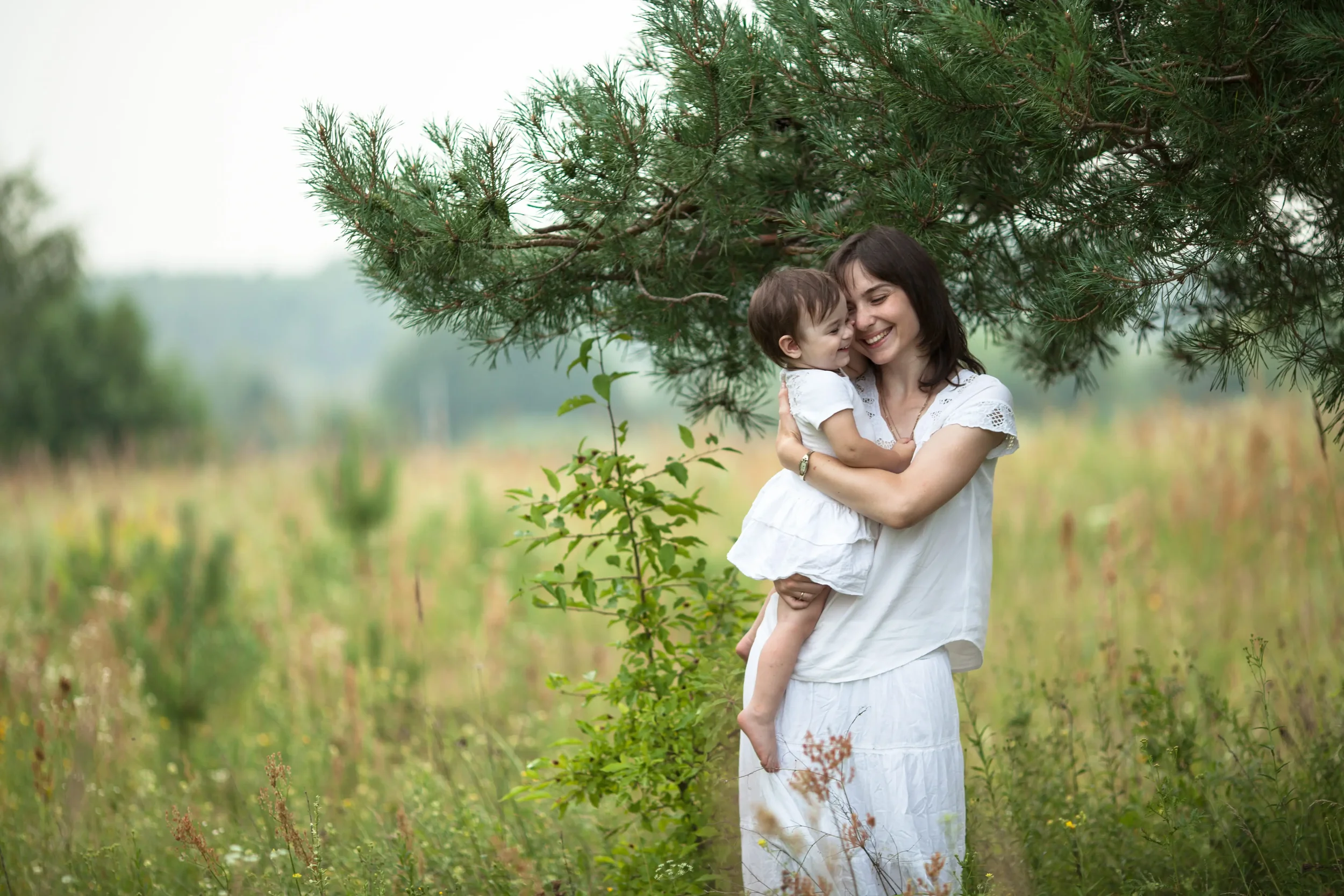 A mother with her baby in the middle of a field - Whole Mother Story