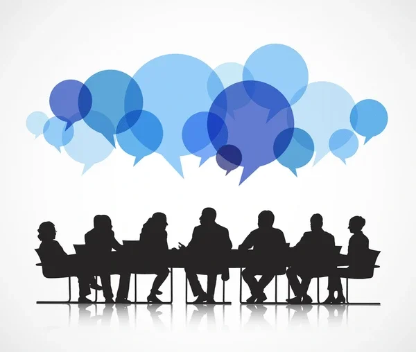 Silhouettes of people sitting at a conference table with speech bubbles above them.