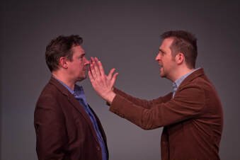 Andrew performing improv with a partner
