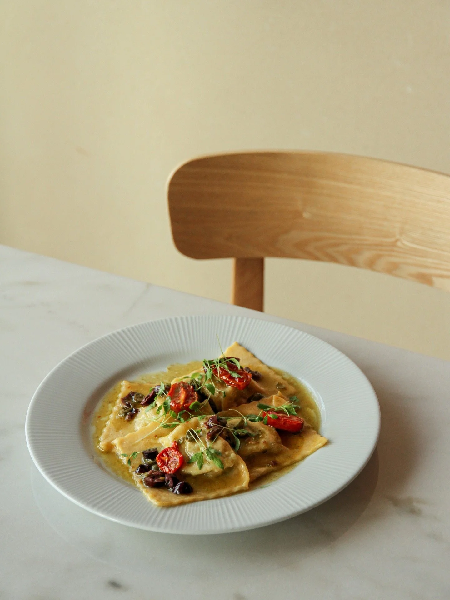 We wanted to create Italian stuffed pasta with a Portuguese soul. Bold? Absolutely.

That&rsquo;s how Ravioli di Baccal&agrave; was born &ndash; filled with salted cod, potato and parsley, then saut&eacute;ed with olives, capers and cherry tomato con