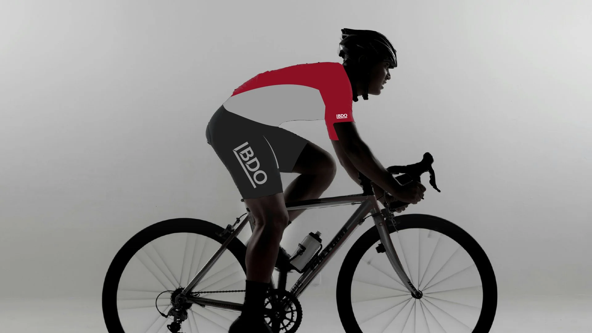 Photo of road cyclist with overlay of BDO cycling kit