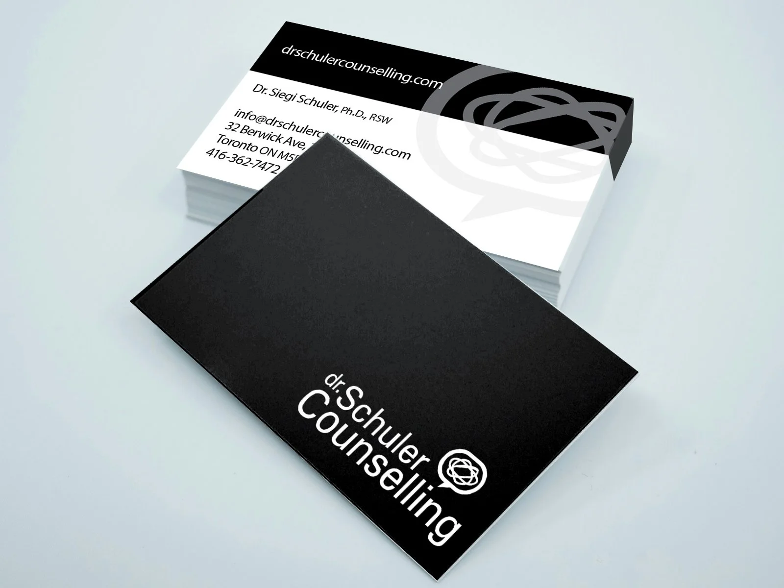 Photo of a stack of Dr. Schuler's business cards