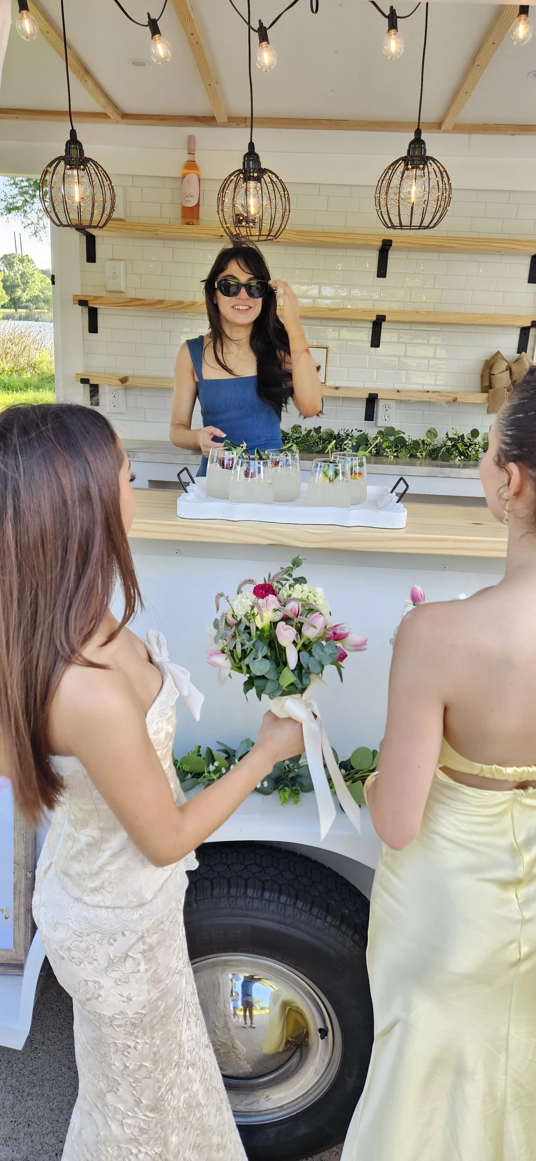 Lumière Bubble Co. luxury mobile bar trailer serving guests signature cocktails at a Dallas-Fort Worth event.