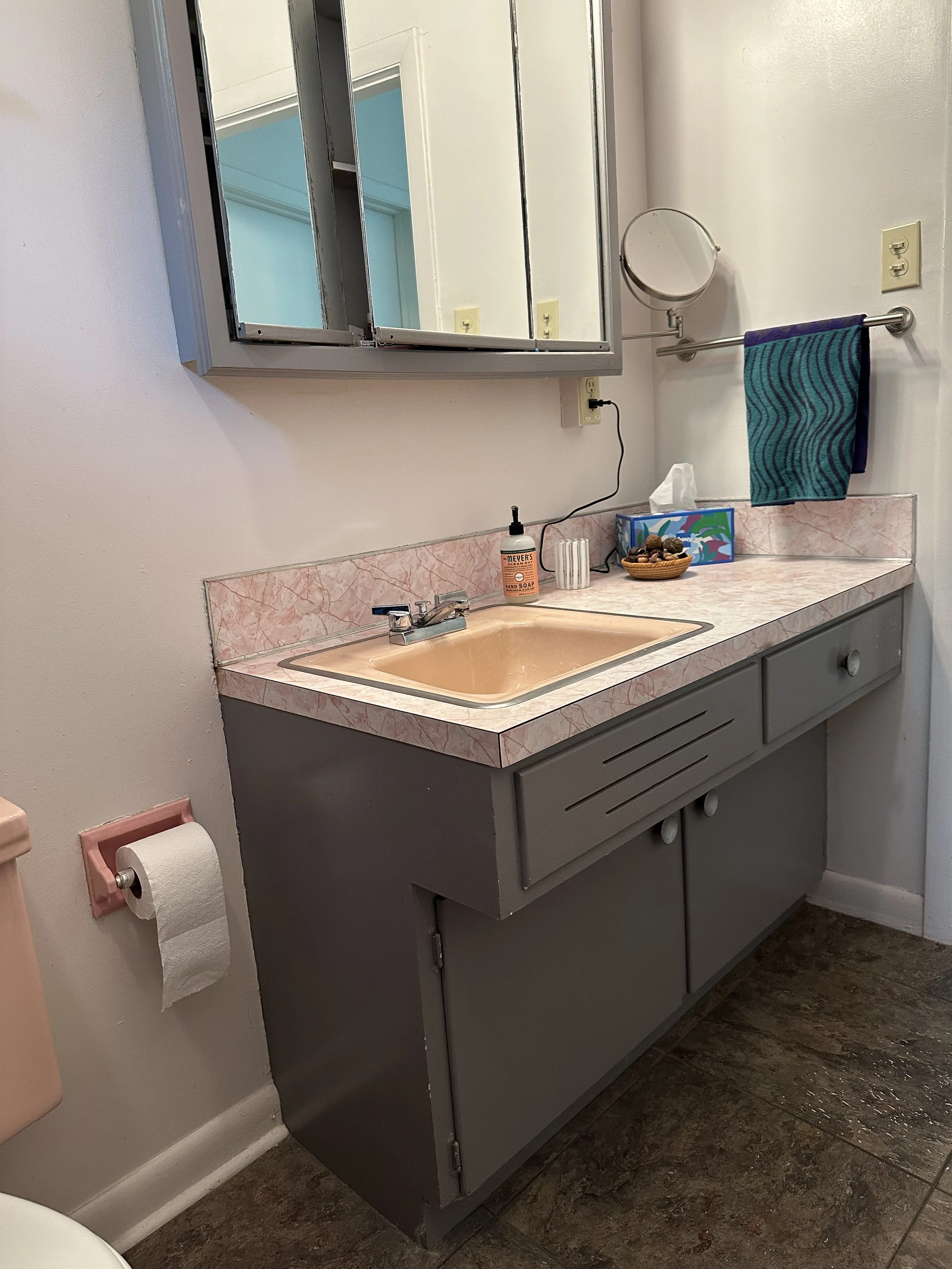 The bathroom, while functional, featured outdated finishes, mismatched fixtures, and limited visual continuity, creating a space that felt both cramped and out of sync with the rest of the home.