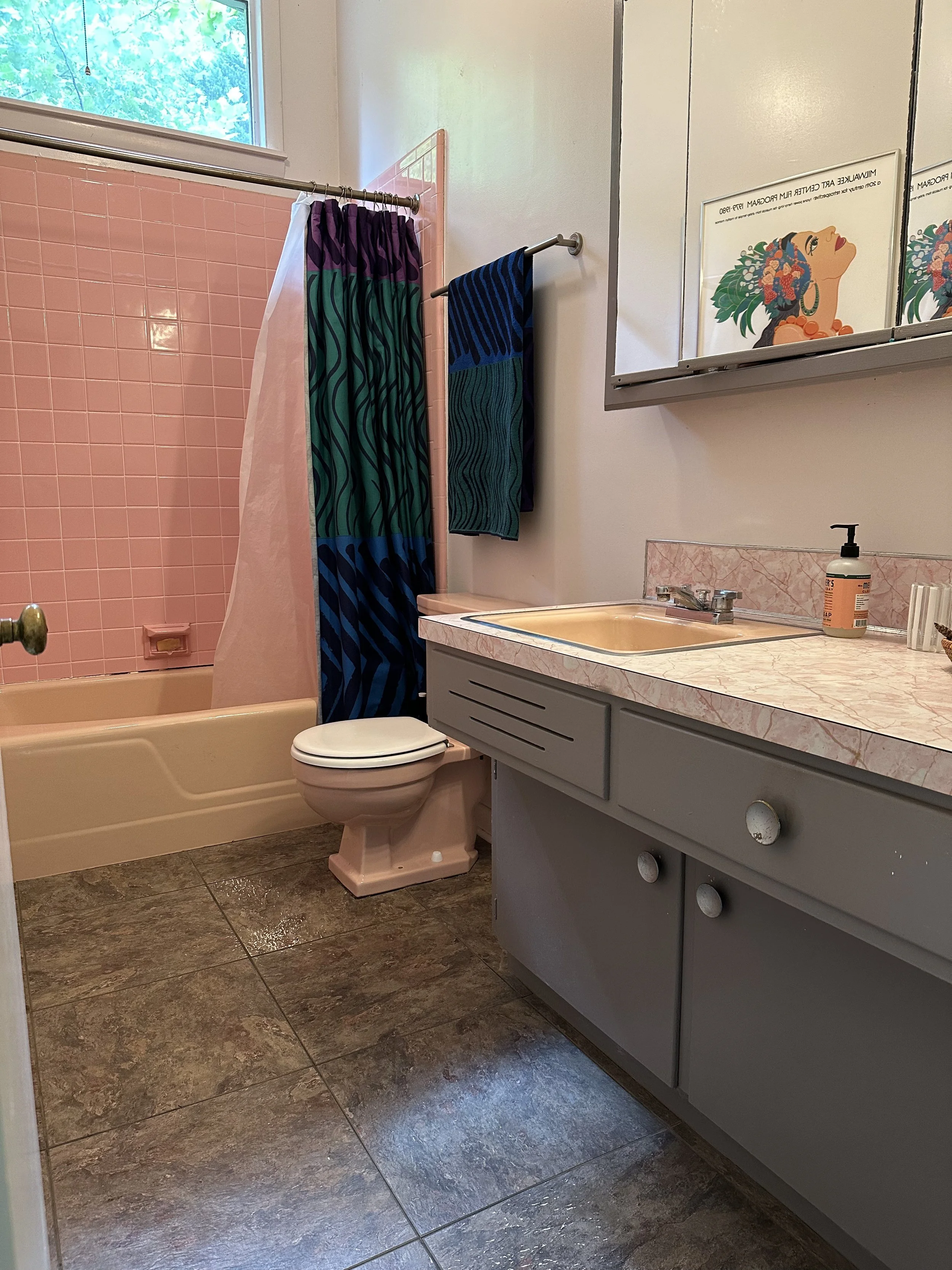 The bathroom, while functional, featured outdated finishes, mismatched fixtures, and limited visual continuity, creating a space that felt both cramped and out of sync with the rest of the home.