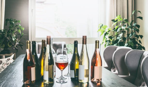 wine bottles and glasses on table.jpg