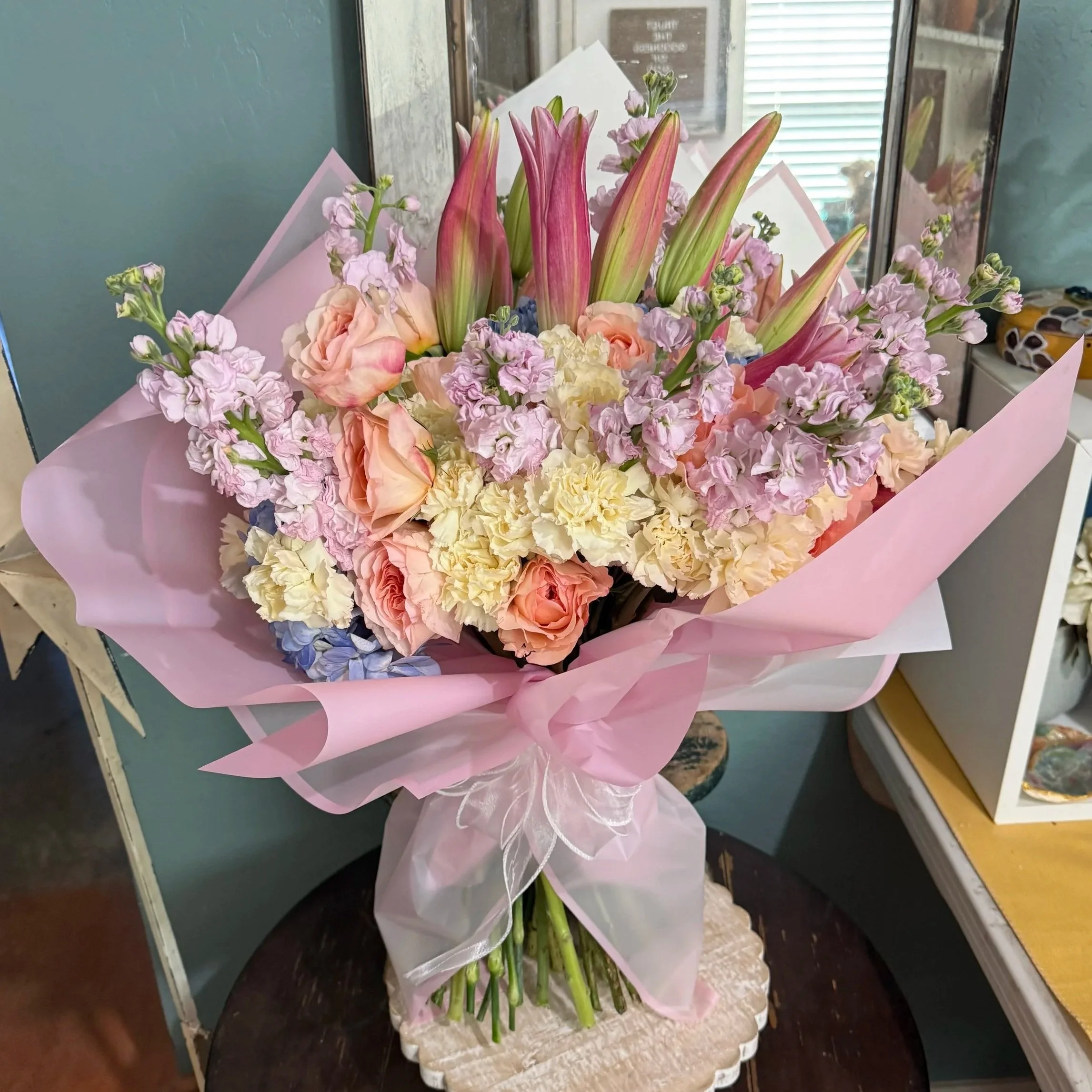 Sweet 16. This bouquet was about 15 lbs of pastels. An amazing color combo that aged well as the lilies opened up. 
