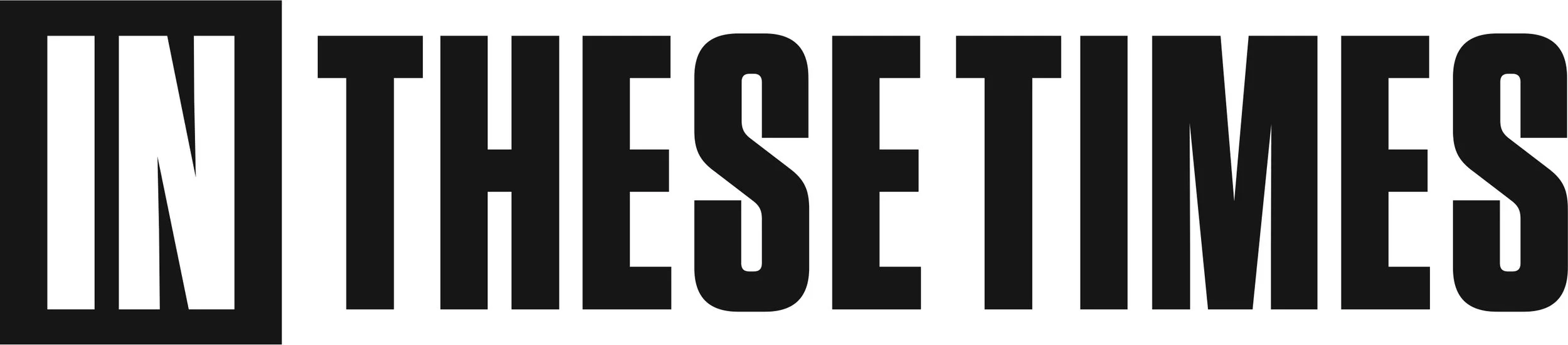 Bold black and white text saying "IN THESE TIMES" against a black background.