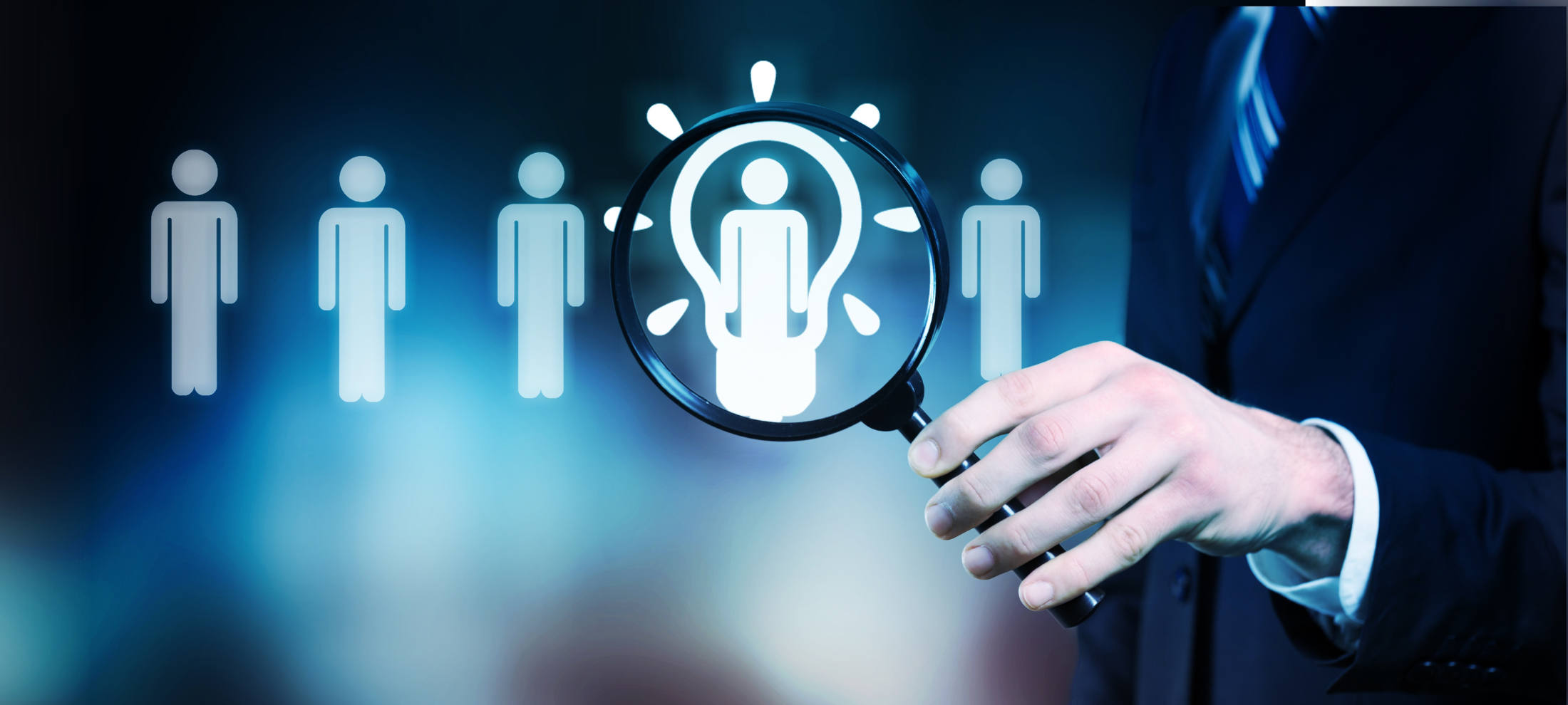 Person in a suit holding a magnifying glass over icons of people, emphasizing one person in the lineup.