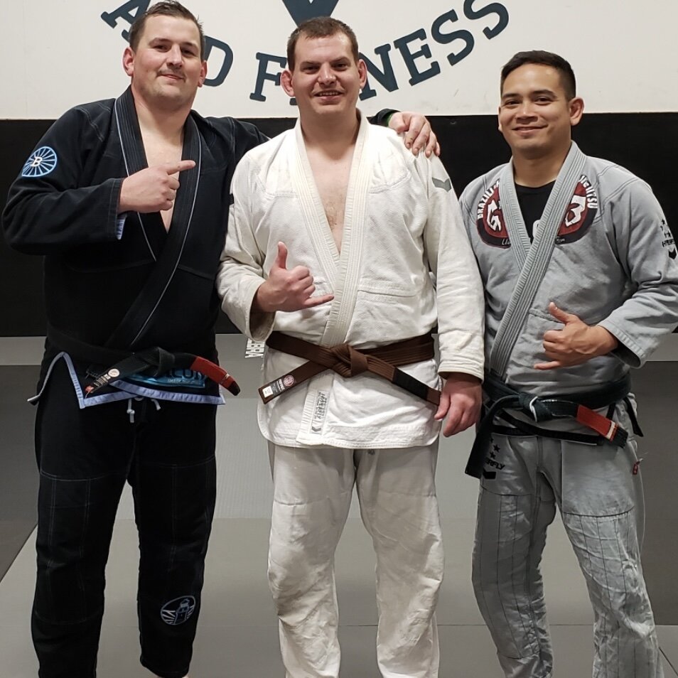 Jason Patchel—Brazilian Jiu-Jitsu Brown Belt (flanked by Coaches Peach and Kirby)