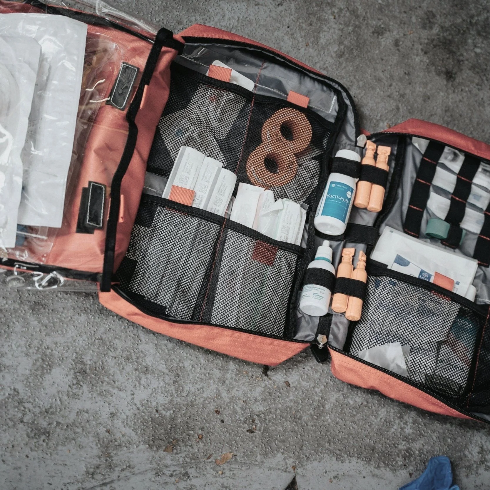 Open emergency response bag with first aid equipment