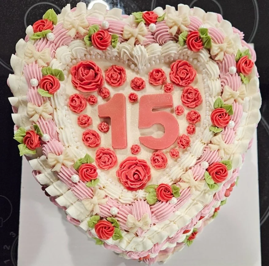 Check out this STUNNING quince a&ntilde;os celebration cake, adorned with vibrant pastel vintage piping. Every single detail on this gorgeous cake is edible, with most of the decorations being handmade from white chocolate for the occasion. Our head 