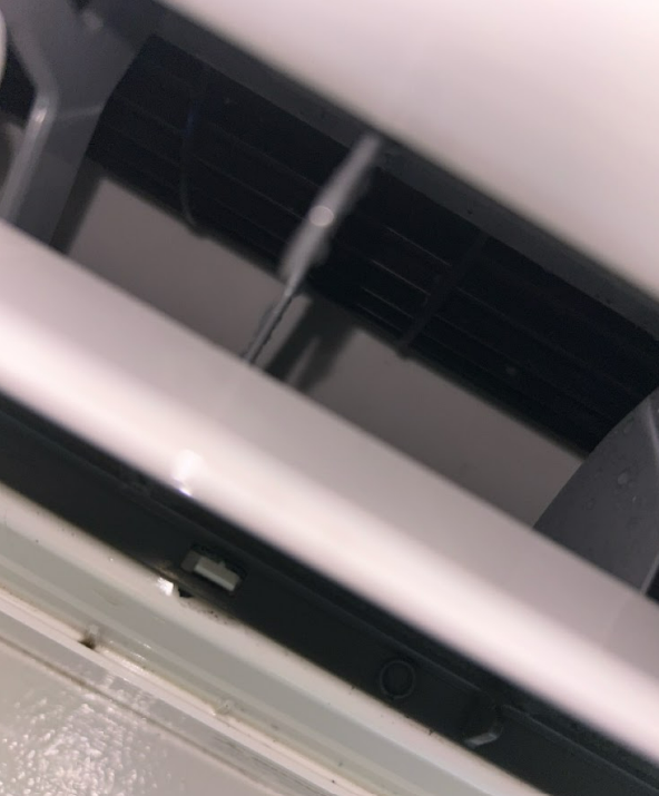Close-up view of an air conditioning unit vent.