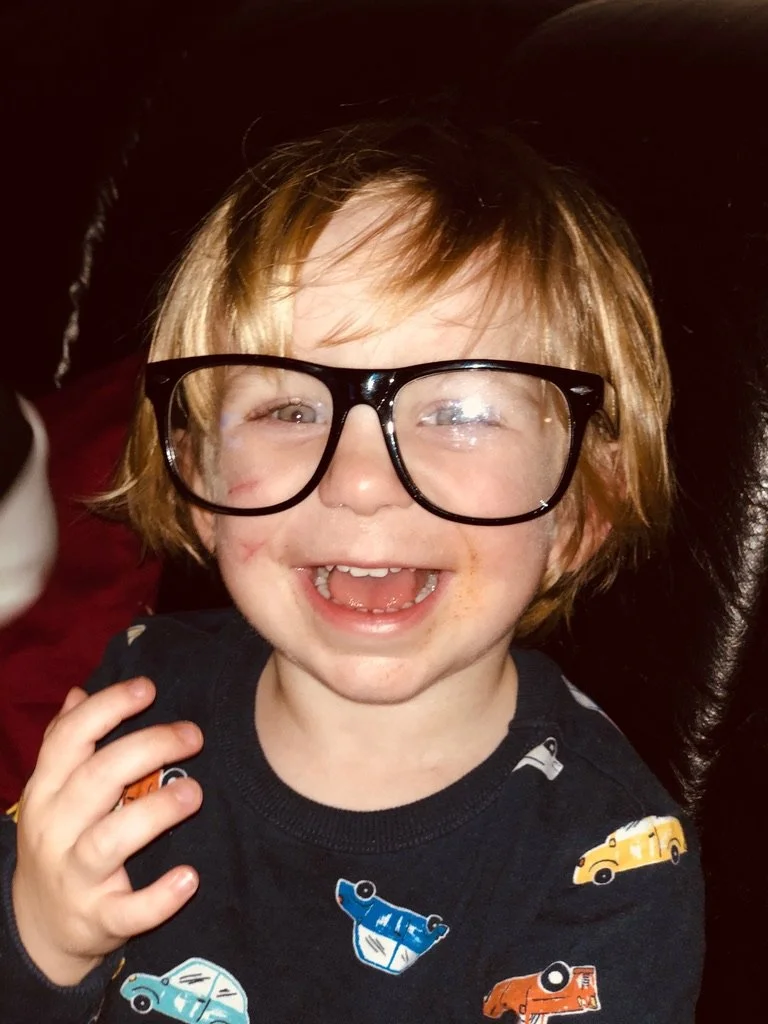 Hazel was here custom illustration reference picture of a cute little boy wearing adult reading glasses.