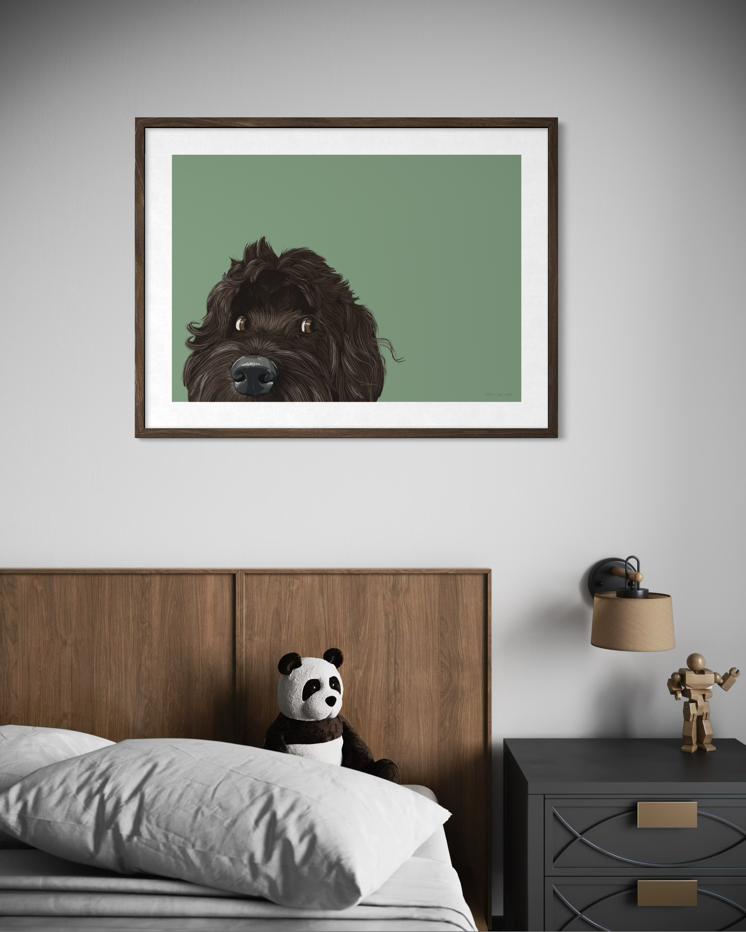 Framed illustration of a brow cockapoo peaking over the edge of the frame by Lisa van Beeck