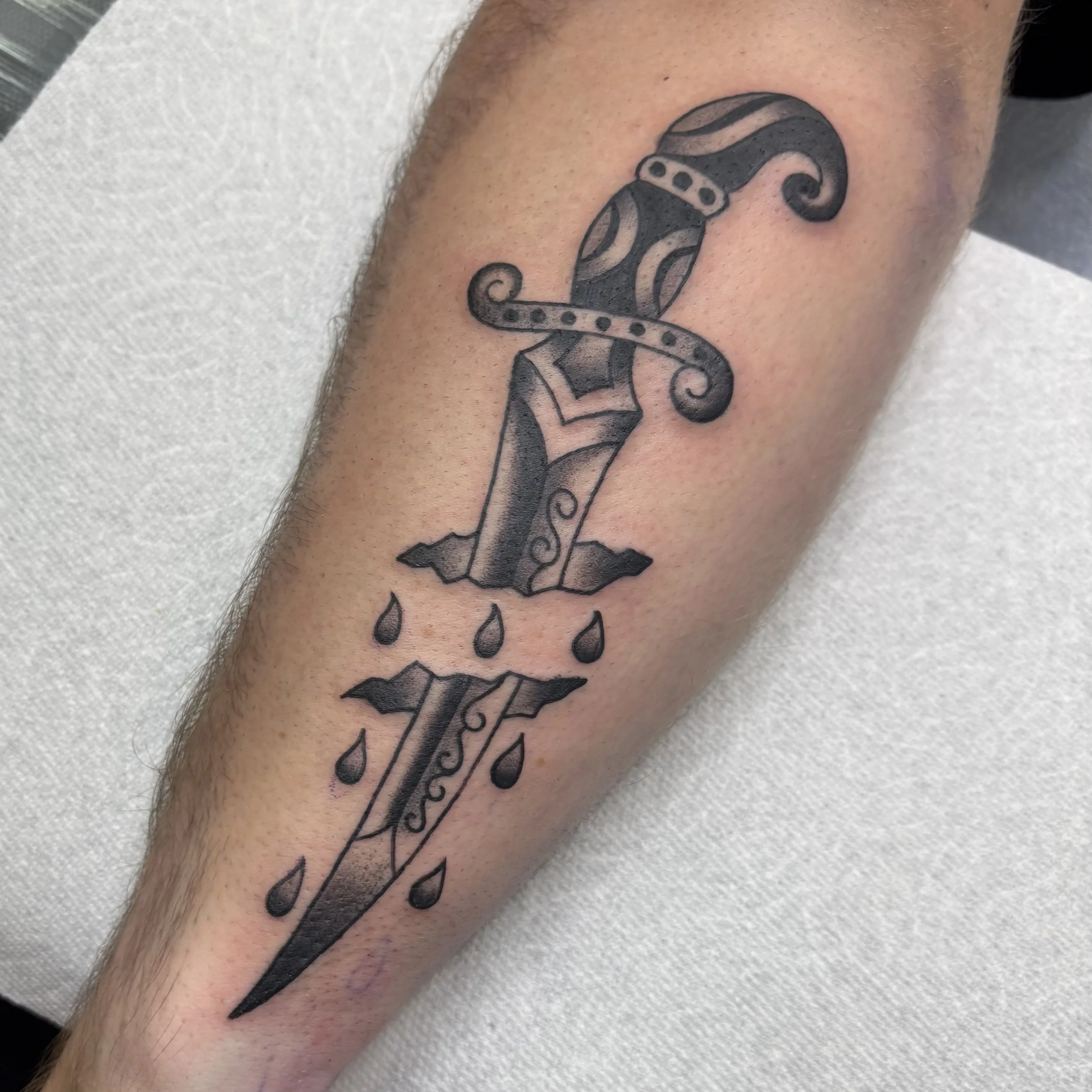 Black and grey American Traditional Dagger, Monterey dagger tattoo, Monterey American traditional tattoo artist