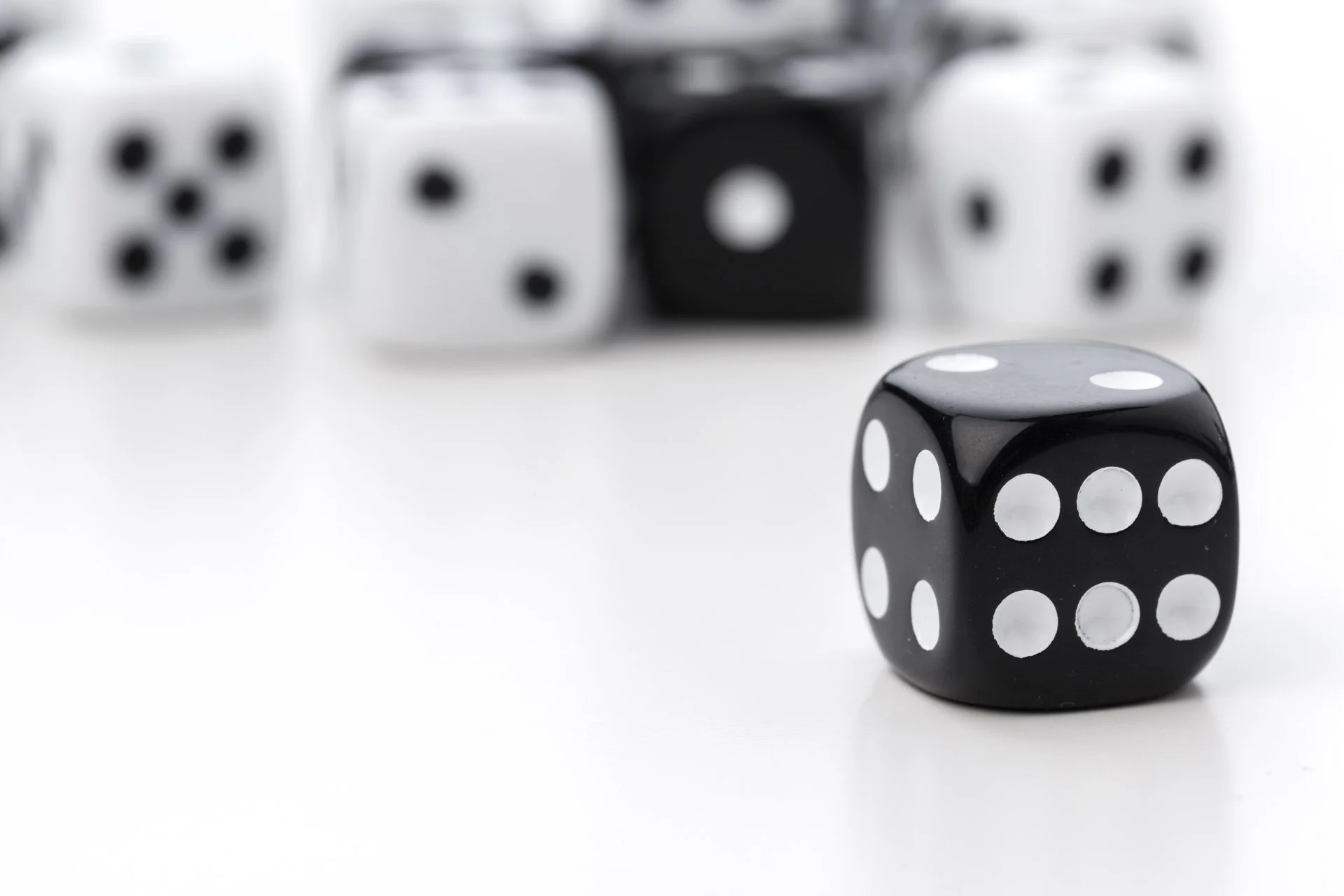 Collection of black and white rolling dice
